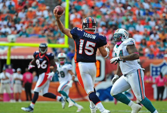 MIAMI GARDENS, FL - OCTOBER 23: Tim Tebow #15 of the Denver Broncos passes against the Miami Dolphins at Sun Life Stadium on October 23, 2011 in Miami Gardens, Florida. (Photo by Scott Cunningham/Getty Images)