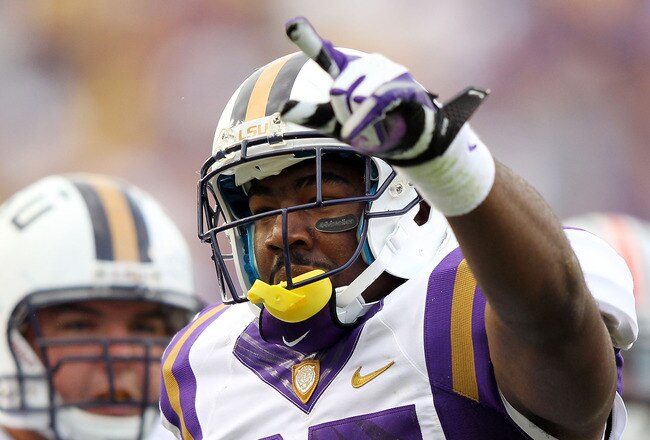 BATON ROUGE, LA - OCTOBER 22:  Kenny Hilliard #27 of the LSU Tigers celebrates after scoring a touchdown during the game against the Auburn Tigers at Tiger Stadium on October 22, 2011 in Baton Rouge, Louisiana.  (Photo by Jamie Squire/Getty Images)