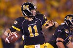 COLUMBIA, MISSOURI - OCTOBER 23: Blaine Gabbert #11 of the Missouri Tigers passes against the Oklahoma Sooners at Faurot Field/Memorial Stadium on October 23, 2010 in Columbia, Missouri.  The Tigers beat the Sooners 36-27.  (Photo by Dilip Vishwanat/Getty Images)