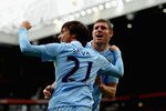 MANCHESTER, ENGLAND - OCTOBER 23: David Silva and James Milner of Manchester City celebrate during the Barclays Premier League match between Manchester United and Manchester City at Old Trafford on October 23, 2011 in Manchester, England. (Photo by Laurence Griffiths/Getty Images)