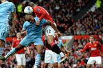 MANCHESTER, ENGLAND - OCTOBER 23:   Chris Smalling of Manchester United goes up for a header with Vincent Kompany of Manchester City during the Barclays Premier League match between Manchester United and Manchester City at Old Trafford on October 23, 2011 in Manchester, England. (Photo by Laurence Griffiths/Getty Images)