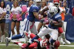 INDIANAPOLIS, IN - OCTOBER 9: Joseph Addai #29, of the Indianapolis Colts  fights to break free from Jovan Belcher #59 of the Kansas City Chiefs during the first half of play at Lucas Oil Field on October 9, 2011 in Indianapolis, Indiana.  (Photo by John Sommers II/Getty Images)