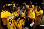 NEW ORLEANS - DECEMBER 21:  Members of the Southern Mississippi Golden Eagles prepare to take the field against the Troy Trojans during the R+L Carriers New Orleans Bowl on December 21, 2008 at the Superdome in New Orleans, Louisiana.  (Photo by Chris Graythen/Getty Images)