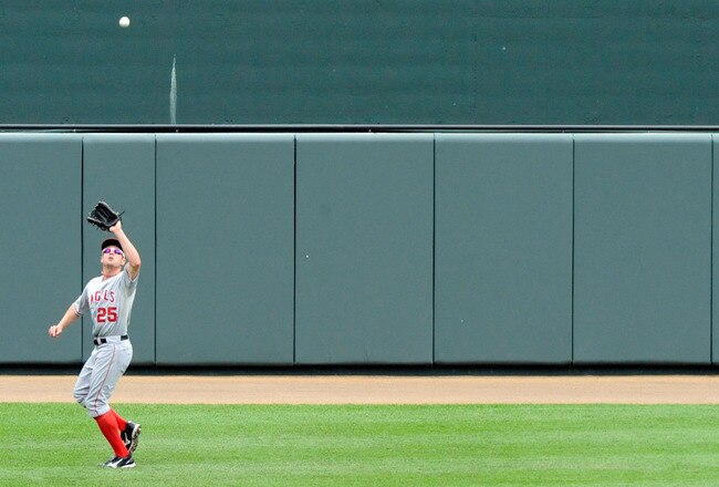 BALTIMORE, MD - SEPTEMBER 18:  Center fielder Peter Bourjos #25 of the Los Angeles Angels of Anaheim catches a fly ball during a baseball game against the Baltimore Orioles at Oriole Park at Camden Yards on September 18, 2011 in Baltimore, Maryland. (Photo by Steve Ruark/Getty Images)