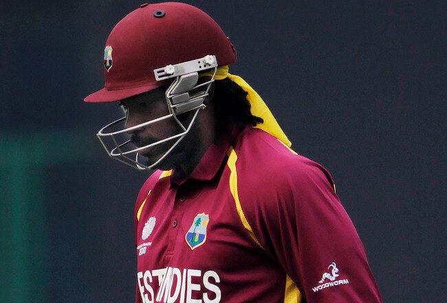DELHI, INDIA - FEBRUARY 24: Chris Gayle of West Indies walks back to the pavillion after being dismissed by Johan Botha of South Africa during the 2011 ICC World Cup Group B match between West Indies and South Africa at Feroz Shah Kotla Stadium on February 24, 2011 in Delhi, India.  (Photo by Daniel Berehulak/Getty Images)