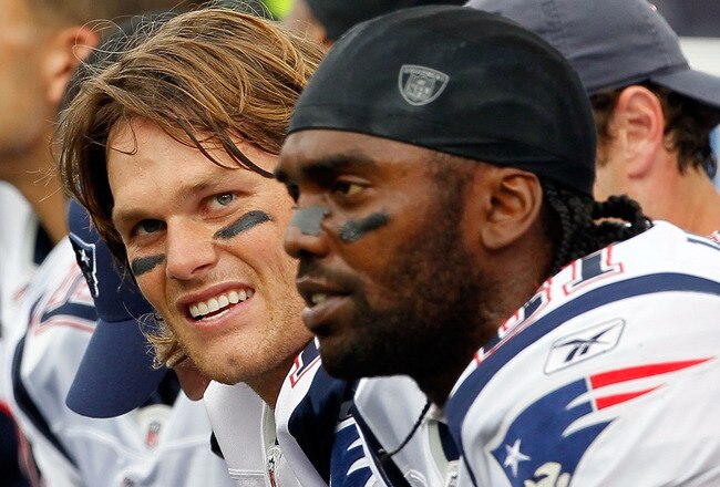 FOXBORO, MA - SEPTEMBER 12: Quarterback Tom Brady #12 and Randy Moss #81 of the New England Patriots take a breather on the bench during the NFL season opener against the Cincinnati Bengals at Gillette Stadium on September 12, 2010 in Foxboro, Massachusetts. (Photo by Jim Rogash/Getty Images)