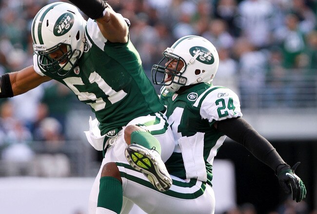 EAST RUTHERFORD, NJ - OCTOBER 23:  Darrelle Revis #24 of the New York Jets celebrates a fourth quarter interception with teammate Aaron Maybin #51 against the San Diego Chargers at MetLife Stadium on October 23, 2011 in East Rutherford, New Jersey.  (Photo by Nick Laham/Getty Images)