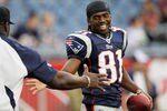 FOXBORO, MA - AUGUST 12: Randy Moss #81 of the New England Patriots smiles before the preseason game against the New Orleans Saints at Gillette Stadium on August 12, 2010 in Foxboro, Massachusetts. (Photo by Jim Rogash/Getty Images)