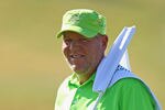 VILAMOURA, PORTUGAL - OCTOBER 12:  John Daly of the USA holds the flag on the 18th green during the pro-am for the Portugal Masters at Oceanico Victoria Golf Course on October 12, 2011 in Vilamoura, Portugal.  (Photo by Richard Heathcote/Getty Images)