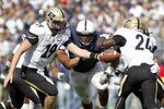 STATE COLLEGE, PA - OCTOBER 15:  Caleb TerBush #19 of the Purdue Boilermakers hands the ball off to Akeem Shavers #24 against the Penn State Nittany Lions during the game on October 15, 2011 at Beaver Stadium in State College, Pennsylvania.  (Photo by Justin K. Aller/Getty Images)
