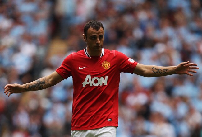 LONDON, ENGLAND - AUGUST 07:  Dimitar Berbatov of Manchester United reacts during the FA Community Shield match sponsored by McDonald's between Manchester City and Manchester United at Wembley Stadium on August 7, 2011 in London, England.  (Photo by Ian Walton/Getty Images)