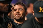 ANAHEIM, CA - SEPTEMBER 23:  David Dejesus #12 of the Oakland Athletics celebrates in the dugout after hitting a solo home run in the ninth inning against the Los Angeles Angels of Anaheim on September 23, 2011 at Angel Stadium in Anaheim, California.   (Photo by Stephen Dunn/Getty Images)