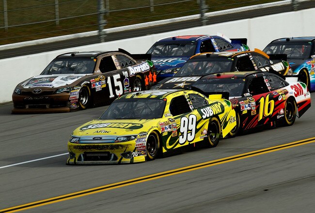 TALLADEGA, AL - OCTOBER 23:  Carl Edwards, driver of the #99 Subway Ford, leads a pack of cars during the NASCAR Sprint Cup Series Good Sam Club 500 at Talladega Superspeedway on October 23, 2011 in Talladega, Alabama.  (Photo by Jeff Zelevansky/Getty Images for NASCAR)