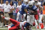 INDIANAPOLIS, IN - OCTOBER 9: Joseph Addai #29, of the Indianapolis Colts  fights to break free from Jovan Belcher #59 of the Kansas City Chiefs during the first half of play at Lucas Oil Field on October 9, 2011 in Indianapolis, Indiana. The Chiefs won 28-24.  (Photo by John Sommers II/Getty Images)