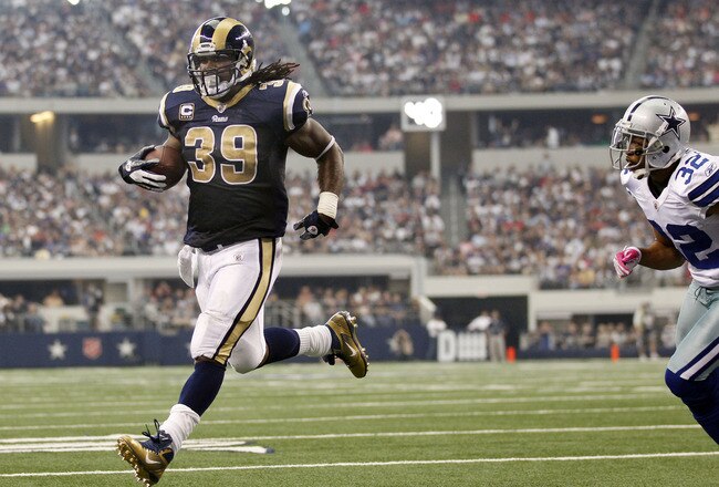 ARLINGTON, TX - OCTOBER 23:  Steven Jackson #39 of the St. Louis Rams runs for a touchdown against cornerback Orlando Scandrick #32 of the Dallas Cowboys at Cowboys Stadium on October 23, 2011 in Arlington, Texas. (Photo by Layne Murdoch/Getty Images)