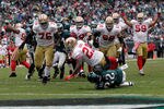 PHILADELPHIA, PA - OCTOBER 02:  Frank Gore #21 of the San Francisco 49ers scores a touchdown while being tackled by Asante Samuel #22 of the Philadelphia Eagles during the second half at Lincoln Financial Field on October 2, 2011 in Philadelphia, Pennsylvania. The 49ers won 24-23.   (Photo by Rob Carr/Getty Images)