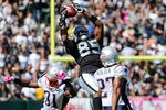 OAKLAND, CA - OCTOBER 02: Darrius Heyward-Bey #85 of the Oakland Raiders catches this pass over Sergio Brown #31 and Antwaun Molden #27 of the New England Patriots during an NFL football game at O.co Coliseum on October 2, 2011 in Oakland, California.  (Photo by Thearon W. Henderson/Getty Images)