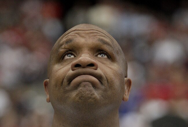HOUSTON, TX - OCTOBER 09:  Head coach Hue Jackson of the Oakland Raiders try to hold back tears during a moment of silence for Oakland Raiders owner, Al Davis as the Raiders are to play the Houston Texans on October 9, 2011 at Reliant Stadium in Houston, Texas. Raider owner, Al Davis died at age 82 at his home Saturday morning.(Photo by Thomas B. Shea/Getty Images)