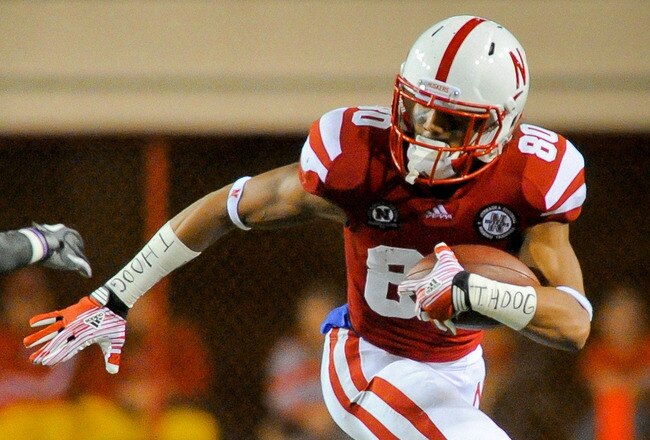 LINCOLN, NE - OCTOBER 8: Wide receiver Kenny Bell #80 of the Nebraska Cornhuskers runs past defensive back Christian Bryant #2 of the Ohio State Buckeyes during their game at Memorial Stadium October 8, 2011 in Lincoln, Nebraska. Nebraska Defeated Ohio State 34-27. (Photo by Eric Francis/Getty Images)