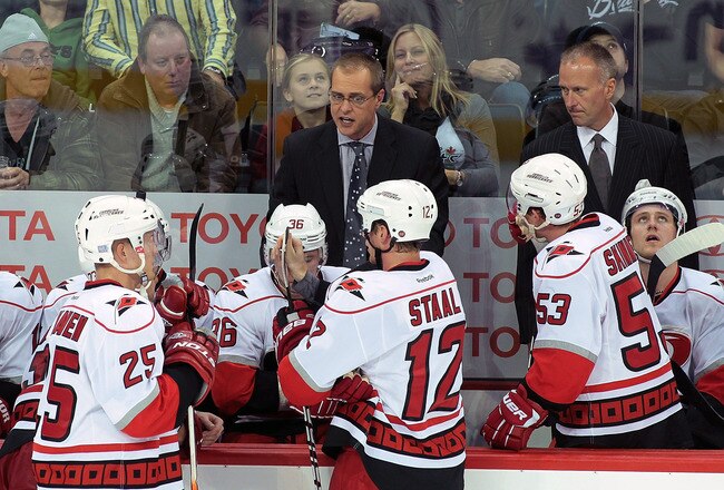 WINNIPEG, CANADA - OCTOBER 22: Head coach Paul Maurice of the Carolina Hurricanes speaks to his team on the bench in a game against the Winnipeg Jets in NHL action at the MTS Centre on October 22, 2011 in Winnipeg, Manitoba, Canada. The Jets won 5-3. (Photo by Marianne Helm/Getty Images)