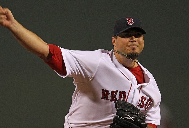 BOSTON, MA - SEPTEMBER 21:  Josh Beckett #19 of the Boston Red Sox throws against the Baltimore Orioles in the 1st inning at Fenway Park September 21, 2011 in Boston, Massachusetts. (Photo by Jim Rogash/Getty Images)