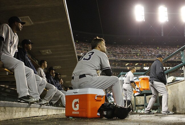 DETROIT, MI - OCTOBER 04: Nick Swisher #33 of the New York Yankees watches the action from the dugout during Game Four of the American League Divison Series against the Detroit Tigers at Comerica Park on October 4, 2011 in Detroit, Michigan.  The Yankees defeated the Tigers 10-1.  (Photo by Leon Halip/Getty Images)
