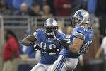 DETROIT, MI - OCTOBER 16: Kyle Vanden Bosch #93 of the Detroit Lions (R) celebrates with teammate Rashied Davis #82 after recovering the fumble from Alex Smith #11 of the San Francisco 49ers during the first quarter of the game against the San Francisco 49ers at Ford Field on October 16, 2011 in Detroit, Michigan.  (Photo by Leon Halip/Getty Images)