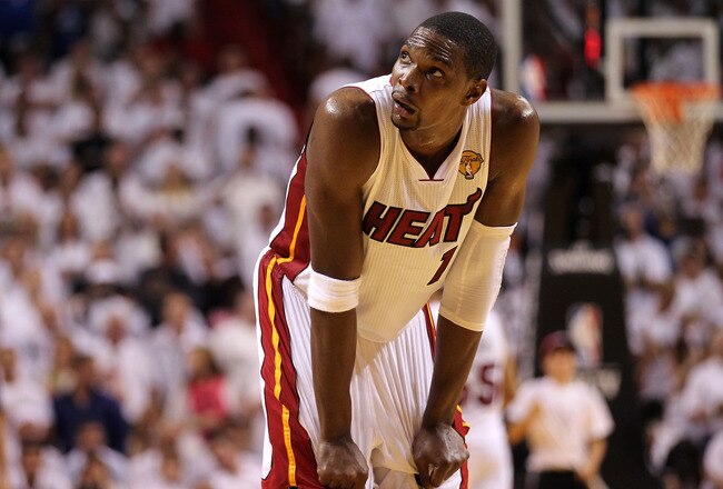 MIAMI, FL - JUNE 12:  Chris Bosh #1 of the Miami Heat looks on against the Dallas Mavericks in Game Six of the 2011 NBA Finals at American Airlines Arena on June 12, 2011 in Miami, Florida. NOTE TO USER: User expressly acknowledges and agrees that, by downloading and/or using this Photograph, user is consenting to the terms and conditions of the Getty Images License Agreement.  (Photo by Mike Ehrmann/Getty Images)