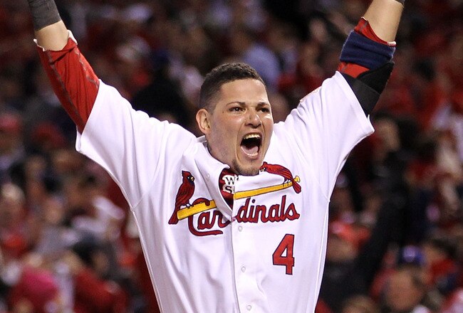 ST LOUIS, MO - OCTOBER 27:  Yadier Molina #4 of the St. Louis Cardinals celebrates after David Freese #23 hits a walk off solo home run in the 11th inning to win Game Six of the MLB World Series against the Texas Rangers at Busch Stadium on October 27, 2011 in St Louis, Missouri. The Cardinals won 10-9.  (Photo by Ezra Shaw/Getty Images)