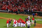 ST LOUIS, MO - OCTOBER 27:  David Freese #23 and the St. Louis Cardinals celebrate on the field after hitting a walk off solo home run in the 11th inning to win Game Six of the MLB World Series against the Texas Rangers at Busch Stadium on October 27, 2011 in St Louis, Missouri. The Cardinals won 10-9.  (Photo by Dilip Vishwanat/Getty Images)