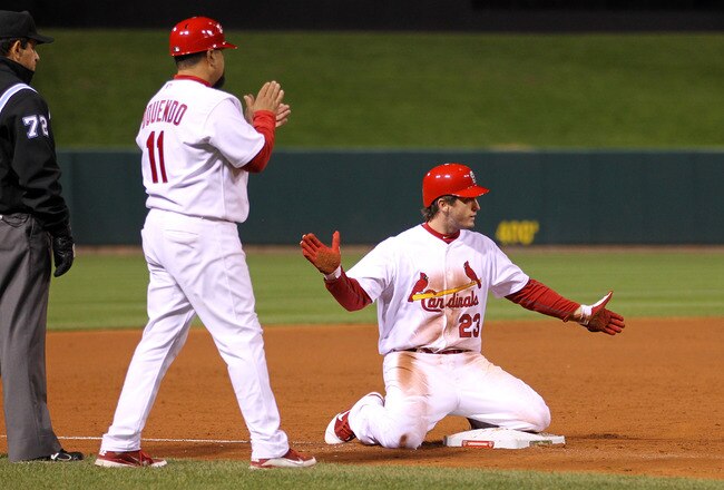 ST LOUIS, MO - OCTOBER 27:  David Freese #23 of the St. Louis Cardinals celebrats at third base after hitting a game-tying two-run triple in the bottom of the ninth inning during Game Six of the MLB World Series against the Texas Rangers at Busch Stadium on October 27, 2011 in St Louis, Missouri. The Cardinals won 10-9 in 11 innings. (Photo by Ezra Shaw/Getty Images)