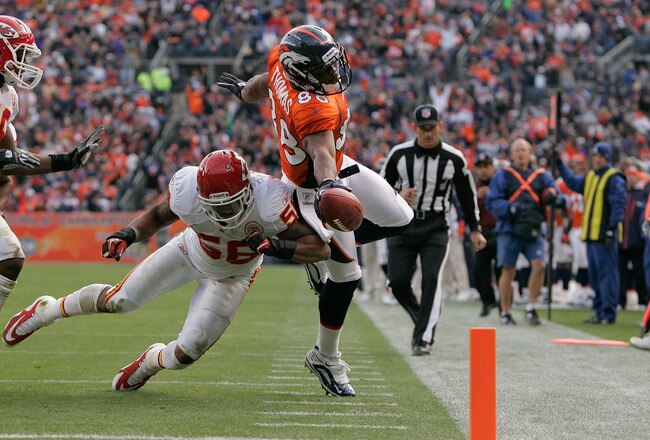 DENVER - NOVEMBER 14:  Wide receiver Demaryius Thomas #88 of the Denver Broncos stretches the ball towards the goal line but is knocked out of bounds by linebacker Derrick Johnson #56 of the Kansas City Chiefs at the 1-yard-line during the second quarter at INVESCO Field at Mile High on November 14, 2010 in Denver, Colorado. The Denver Broncos defeated the Kansas City Chiefs 49-29. (Photo by Justin Edmonds/Getty Images)