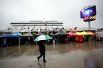 MARTINSVILLE, VA - OCTOBER 28:  Rain falls prior to practice for the NASCAR Sprint Cup Series TUMS Fast Relief 500 at Martinsville Speedway on October 28, 2011 in Martinsville, Virginia.  (Photo by Jeff Zelevansky/Getty Images for NASCAR)