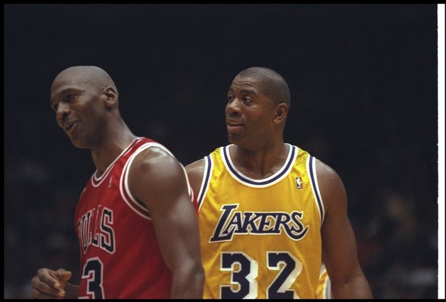 2 Feb 1996:  Guard Earvin (Magic) Johnson of the Los Angeles Lakers confers with Chicago Bulls guard Michael Jordan during a game at the Great Western Forum in Inglewood, California.  The Bulls won the game, 99-84. Mandatory Credit: ALLSPORT USA  /Allspor