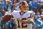 CHARLOTTE, NC - OCTOBER 23: John Beck #12 of the Washington Redskins passes against the Carolina Panthers at the Bank of America Stadium on October 23, 2011 in Charlotte, North Carolina.  (Photo by Dilip Vishwanat/Getty Images)