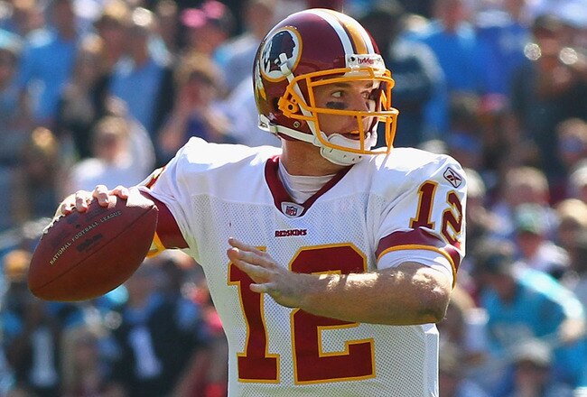 CHARLOTTE, NC - OCTOBER 23: John Beck #12 of the Washington Redskins passes against the Carolina Panthers at the Bank of America Stadium on October 23, 2011 in Charlotte, North Carolina.  (Photo by Dilip Vishwanat/Getty Images)