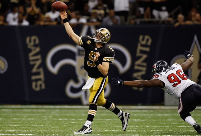 NEW ORLEANS, LA - SEPTEMBER 25:  Drew Brees #9 of the New Orleans Saints throws a pass during the game against the Houston Texans at the Louisiana Superdome on September 25, 2011 in New Orleans, Louisiana.  (Photo by Chris Graythen/Getty Images)
