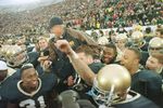 23 Nov1996:  Head coach Lou Holtz of the Notre Dame Fighting Irish is carried off the field by his team after defeating the Rutgers Scarlet Knights 62-0 at Notre Dame Stadium in South Bend, Indiana.  Mandatory Credit: Jonathan Daniel/Allsport