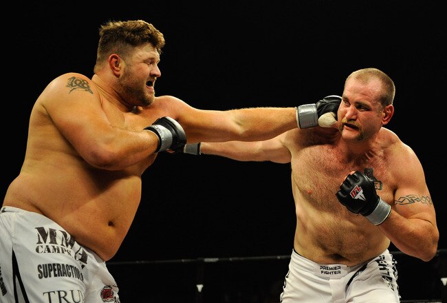 UNCASVILLE, CT - MAY 16:  Roy Nelson (L) of the Lions Den throws a punch at Brad Imes (R) MilesTech Fighting System during their bout presented by the International Fighting League at the Mohegan Sun Arena May 16, 2008 in Uncasville, Connecticut.  (Photo by Jeff Zelevansky/Getty Images for IFL)