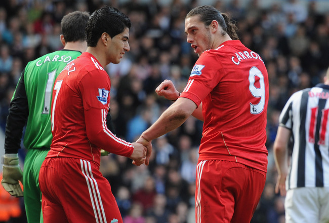 WEST BROMWICH, ENGLAND - APRIL 02: Andy Carroll and Luis Suarez of Liverpool look dejected after a missed chance during the Barclays Premier League match between West Bromwich Albion and Liverpool at The Hawthorns on April 2, 2011 in West Bromwich, England. (Photo by Michael Regan/Getty Images)