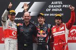 NOIDA, INDIA - OCTOBER 30:  Race winner Sebastian Vettel (2nd R) of Germany and Red Bull Racing celebrates on the podium with Red Bull Racing Chief Technical Officer Adrian Newey (2nd L), second placed Jenson Button (L) of Great Britain and McLaren and third placed Fernando Alonso (R) of Spain and Ferrari following the Indian Formula One Grand Prix at the Buddh International Circuit on October 30, 2011 in Noida, India.  (Photo by Mark Thompson/Getty Images)