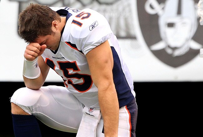 OAKLAND, CA - DECEMBER 19:  Tim Tebow #15 of the Denver Broncos kneels on the ground before their game against the Oakland Raiders at Oakland-Alameda County Coliseum on December 19, 2010 in Oakland, California.  (Photo by Ezra Shaw/Getty Images)