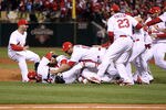 ST LOUIS, MO - OCTOBER 28:  Jason Motte #30 and Yadier Molina #4 of the St. Louis Cardinals celebrate after defeating the Texas Rangers 6-2 to win Game Seven of the MLB World Series at Busch Stadium on October 28, 2011 in St Louis, Missouri.  (Photo by Ezra Shaw/Getty Images)