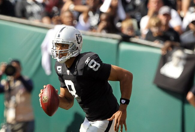 OAKLAND, CA - OCTOBER 16:  Jason Campbell #8 of the Oakland Raiders runs with the ball against the Cleveland Browns at O.co Coliseum on October 16, 2011 in Oakland, California.  (Photo by Ezra Shaw/Getty Images)