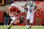 LINCOLN, NE - OCTOBER 29: Defensive back Lance Thorell #23 of the Nebraska Cornhuskers takes the ball away from wide receiver B.J. Cunningham #3 of the Michigan State Spartans during their game at Memorial Stadium October 29, 2011 in Lincoln, Nebraska. (Photo by Eric Francis/Getty Images)