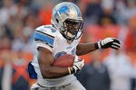 DENVER, CO - OCTOBER 30:  Running back Keiland Williams #34 of the Detroit Lions rushes against the Denver Broncos Sports Authority at Invesco Field at Mile High on October 30, 2011 in Denver, Colorado. The Lions defeated the Broncos 45-10.  (Photo by Doug Pensinger/Getty Images)