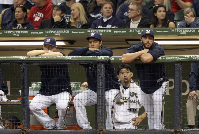 MILWAUKEE, WI - OCTOBER 16:  (L-R) Chris Narveson #38, Yovani Gallardo #49, Takashi Saito #40 and George Kottaras #16 of the Milwaukee Brewers look on dejected from the dugout late in the game against the St. Louis Cardinals during Game Six of the National League Championship Series at Miller Park on October 16, 2011 in Milwaukee, Wisconsin.  (Photo by Christian Petersen/Getty Images)