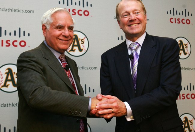 FREMONT, CA - NOVEMBER 14:  Lew Wolff (L) owner and managing partner of the Oakland Athletics poses for pictures with President and CEO of Cisco Systems John Chambers, announcing the building of a new ballpark in Fremont, California, on land owned by Cisco Systems, at their headquarters on November 14, 2006 in San Jose, California. The Oakland A's will purchase the land from Cisco and have sold the naming rights for the new ballpark to Cisco Systems Inc.   (Photo by Jed Jacobsohn/Getty Images)