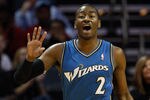 CHARLOTTE, NC - JANUARY 08:  John Wall #2 of the Washington Wizards calls a play against the Charlotte Bobcats during their game at Time Warner Cable Arena on January 8, 2011 in Charlotte, North Carolina. NOTE TO USER: User expressly acknowledges and agrees that, by downloading and/or using this Photograph, User is consenting to the terms and conditions of the Getty Images License Agreement.  (Photo by Streeter Lecka/Getty Images)