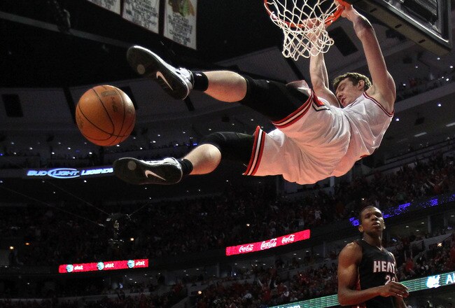 CHICAGO, IL - MAY 15:  Omer Asik #3 of the Chicago Bulls dunks against the Miami Heat in Game One of the Eastern Conference Finals during the 2011 NBA Playoffs on May 15, 2011 at the United Center in Chicago, Illinois. The Bulls won 103-82. NOTE TO USER: User expressly acknowledges and agrees that, by downloading and or using this photograph, User is consenting to the terms and conditions of the Getty Images License Agreement  (Photo by Jonathan Daniel/Getty Images)